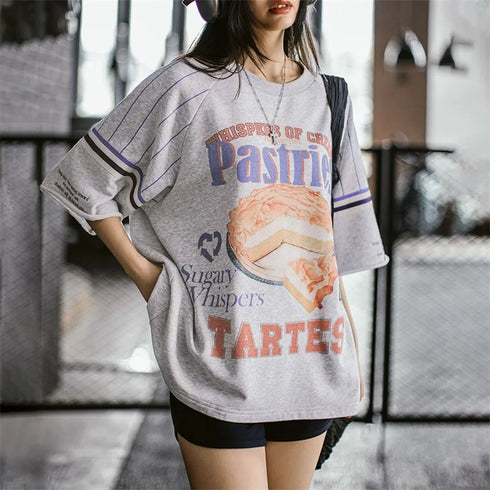 Person wearing a graphic t-shirt with text and a pie illustration.